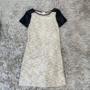 Classic dress with leather sleeves